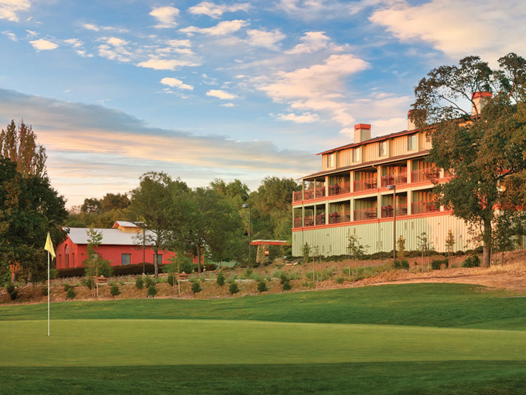 Golf green and resort buildings at Club Wyndham Angels Camp, ideal for those looking to sell wyndham timeshare.