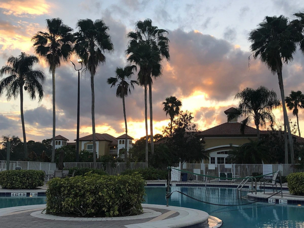 Sunset over the pool at Sheraton PGA Vacation Resort. Learn how much does marriott timeshare cost.