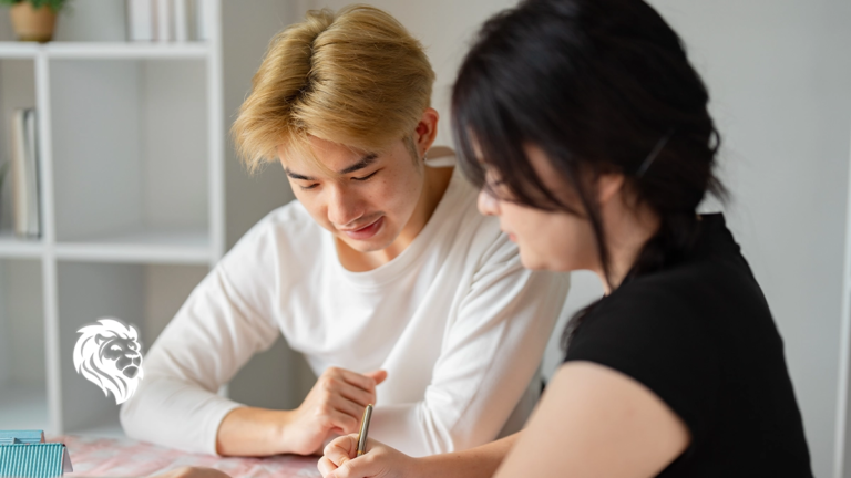 A young couple signing paperwork after researching what documents do i need to sell my timeshare.