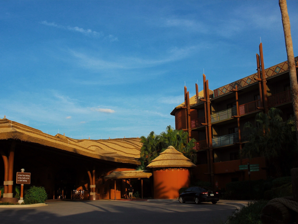 Thatched-roof lodge architecture at Kidani Village, a great destination for labor day travel.