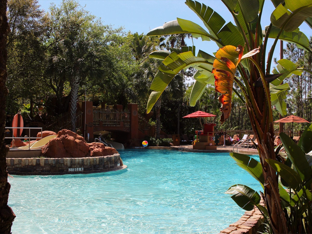 Samawati Springs Pool surrounded by palm trees, an amenity boosting animal kingdom lodge DVC resale value.