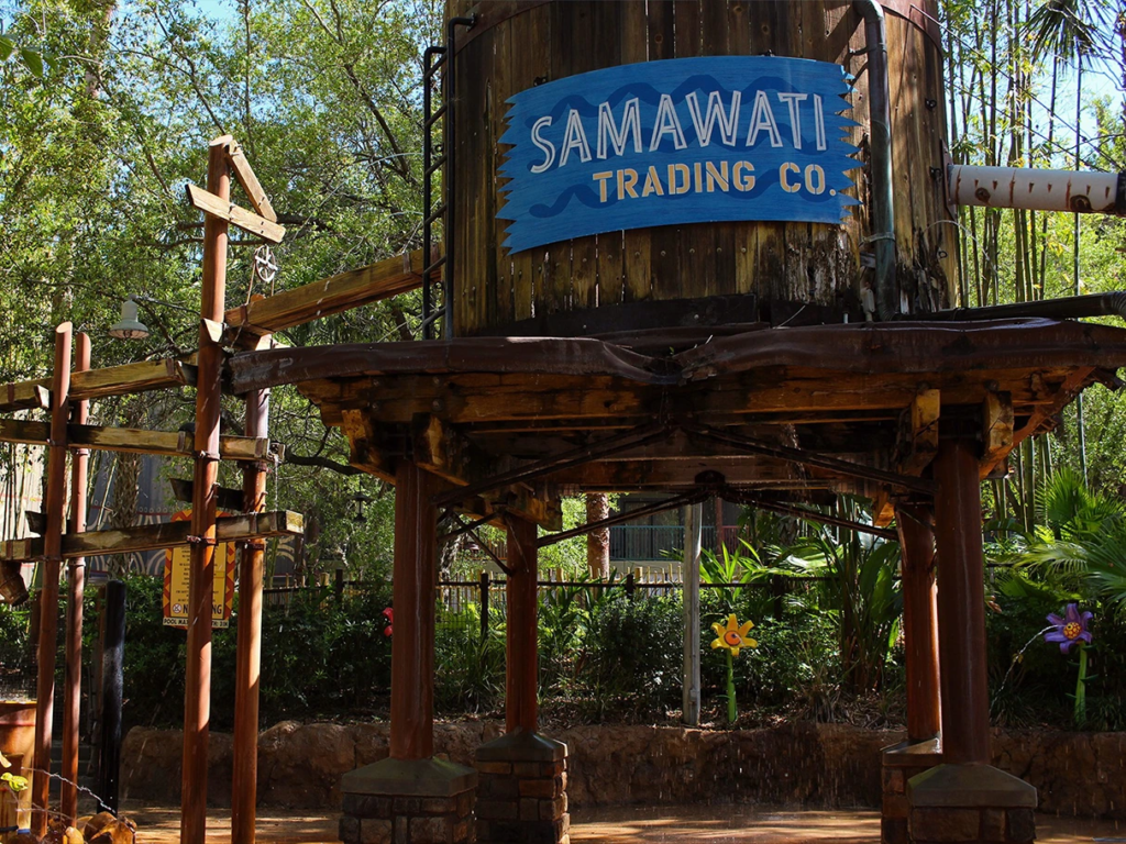 Wooden water play structure with a Samawati Trading Co sign at Disney's Animal Kingdom Lodge pool.