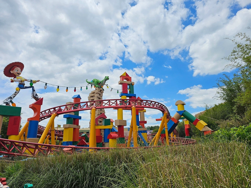 Jessie and Rex figures atop the Slinky Dog Dash coaster at Disney's Hollywood Studios, fun for labor day travel.
