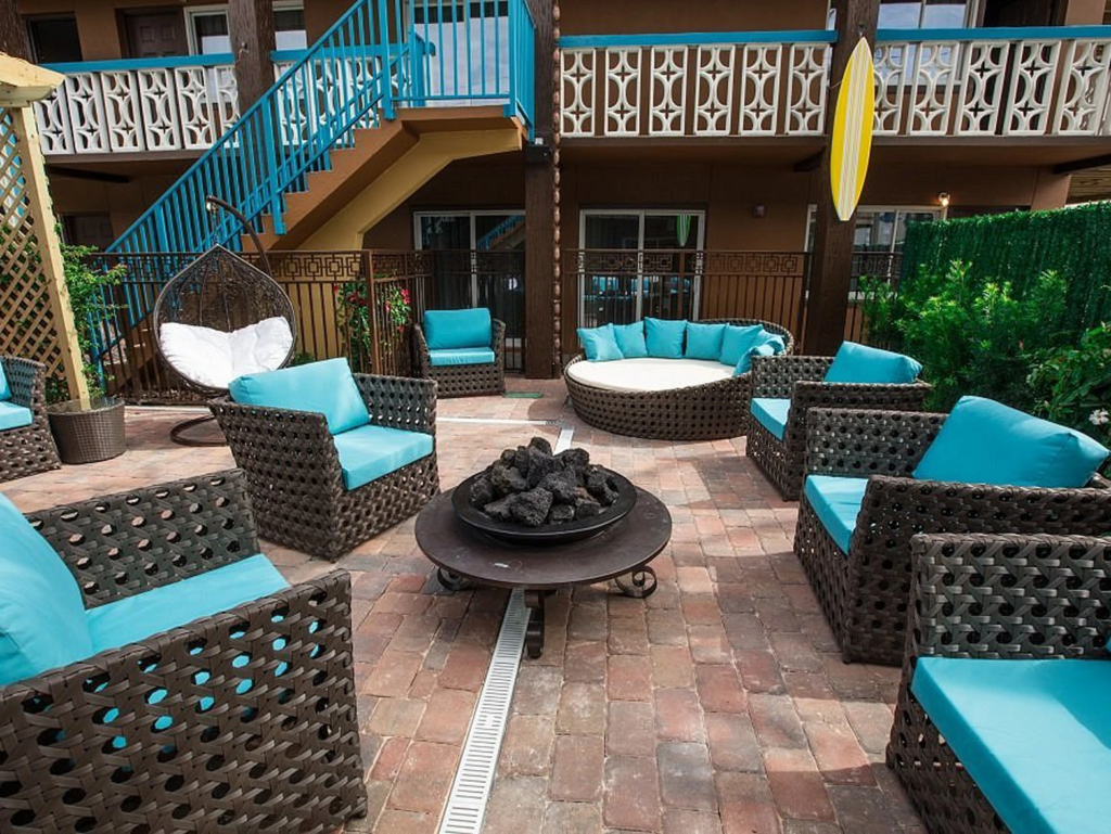 Wicker patio seating around a fire pit at Westgate Cocoa Beach Resort, a plus for westgate timeshare resale value.