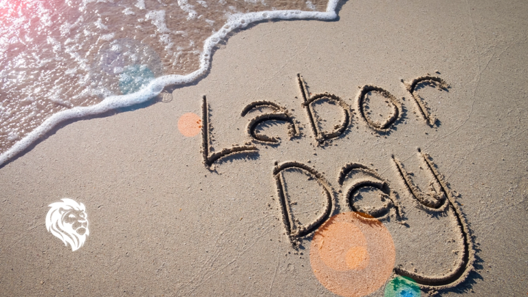 The words Labor Day written in the sand, capturing the essence of labor day travel.