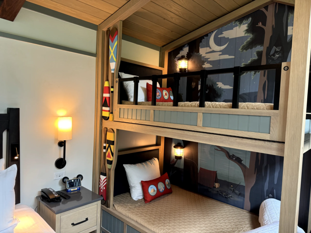 Bunk bed nook with a camp mural and paddle decor in a Disney Vacation Club villa.