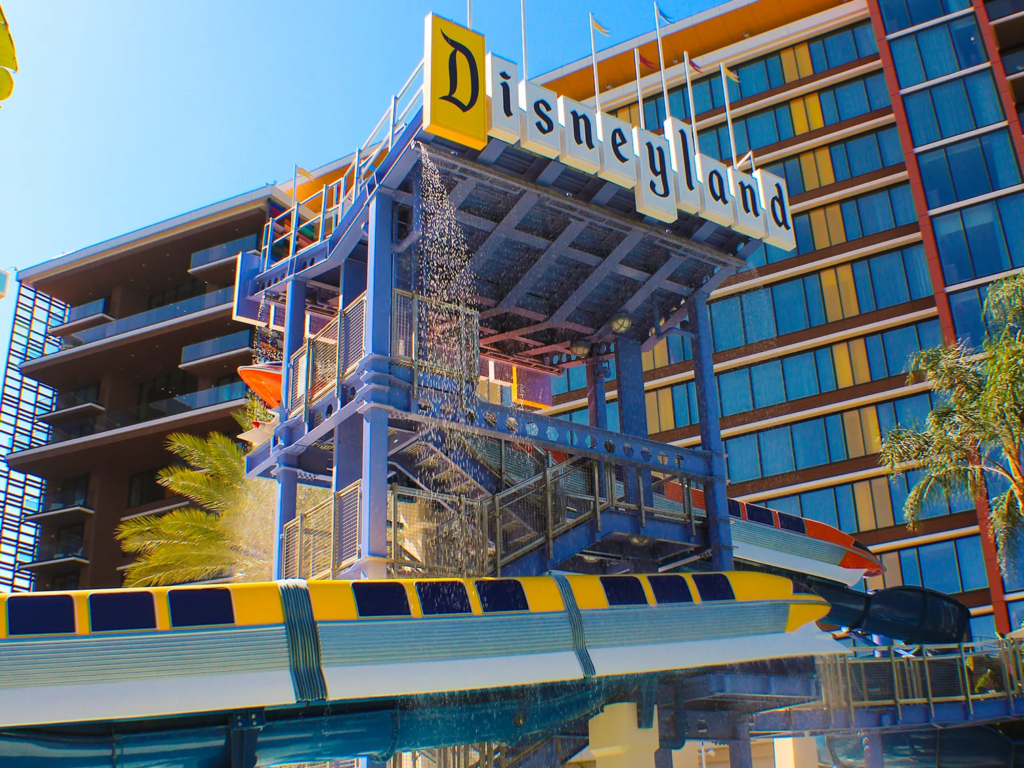 Disneyland Hotel exterior with water slide and monorail, a Disney Vacation Club property sold through DVC resale companies.