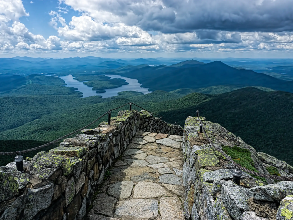 Stone summit deck at one of the most scenic romantic getaways in upstate NY, overlooking Lake Placid and the Adirondacks.