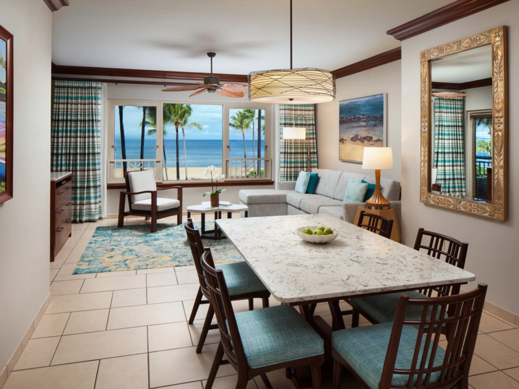 A dining and living room with ocean views at Marriott's Maui Ocean Club, near some of the best places to snorkel in maui.