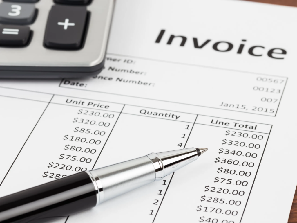 A 2015 invoice and pen beside a brochure explaining how to cancel my timeshares boca raton style contracts.